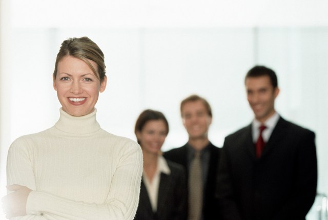 Cheerful Businesswoman with Colleagues